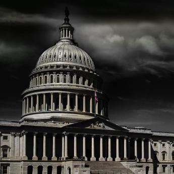 U.S. Capitol with dark clouds
