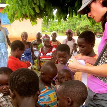 Children in Ghana learning about water quality from wells and streams.