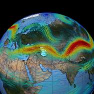 Image of the globe with the Western Hemisphere Eurasian continent facing front, with colored bands to indicate jet streams moving across the surface of the Earth