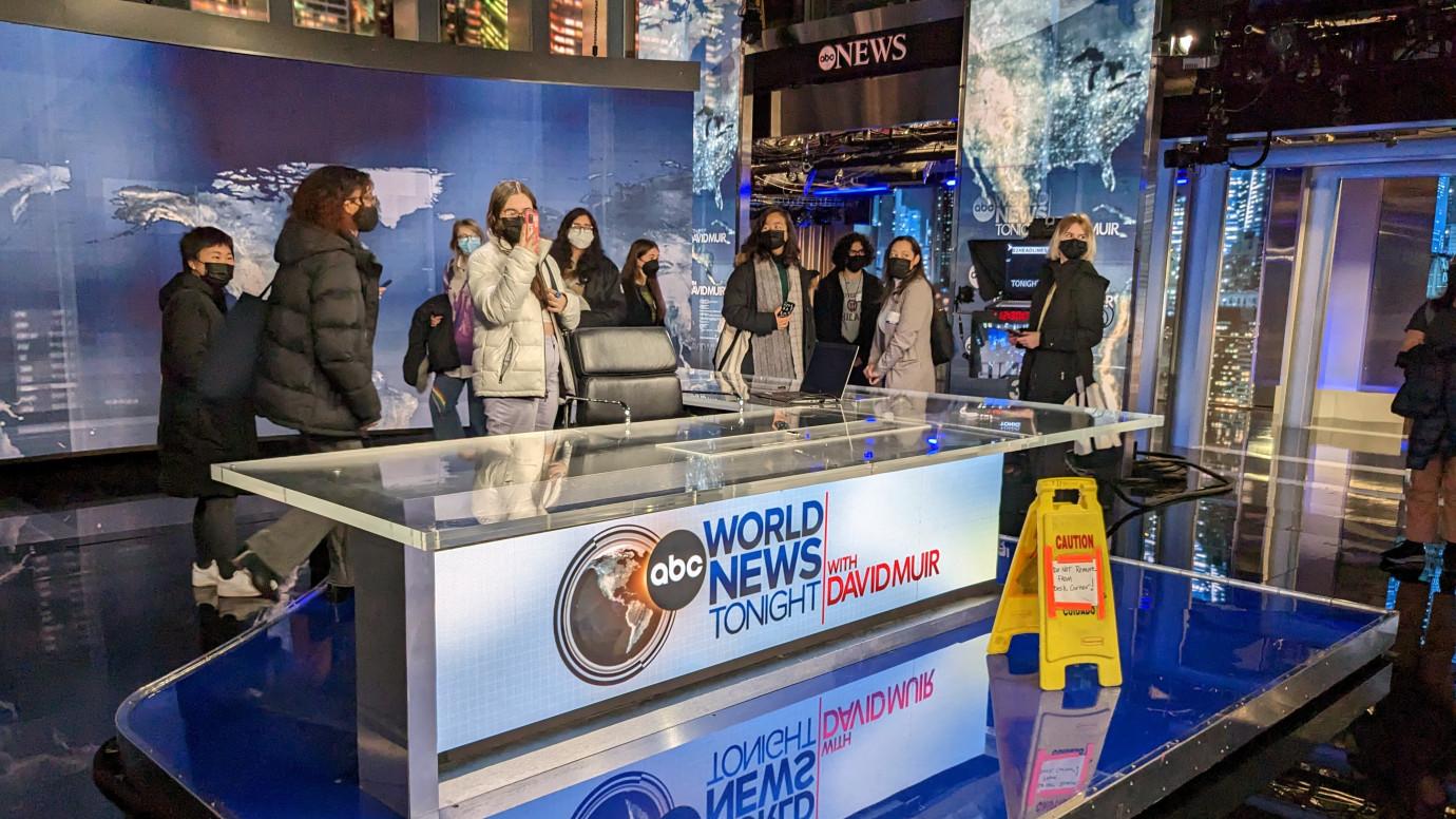 Students pose for a group photo on the set of ABC World News Tonight