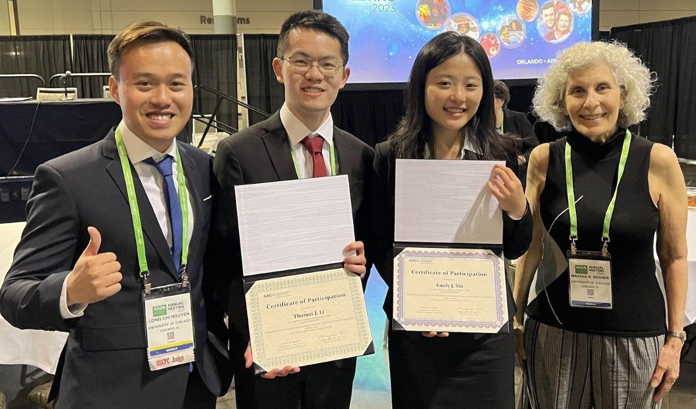 Long Nguyen, Thomas Li, Emily Shi and Marsha Rosner at the 2023 American Association for Cancer Research's annual meeting in Orlando, Florida