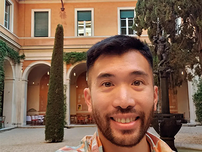 Baldwin Giang poses in the open courtyard of the American Academy in Rome. 