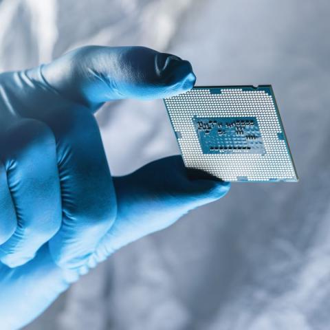 Scientist holding microchip 