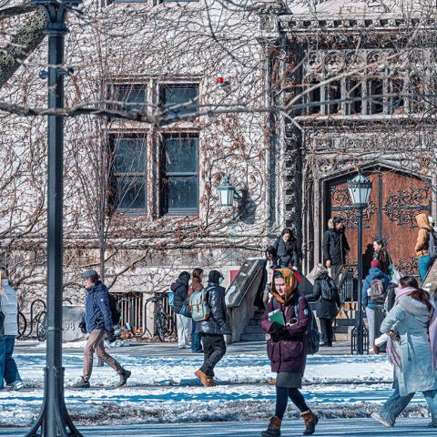Students walk through snow on campus
