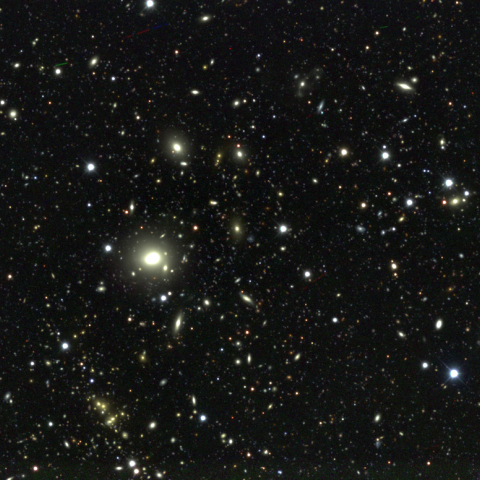 wide-field image of stars and galaxies in the night sky