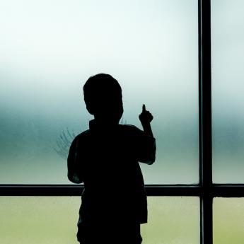 Child alone at window