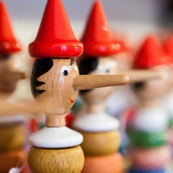 A row of wooden Pinocchio toys