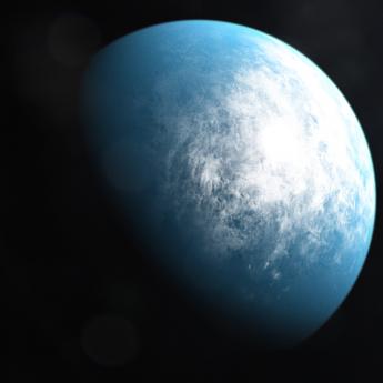 Visualization of a blue planet half in shadow, with mass of clouds gathered over the bright side