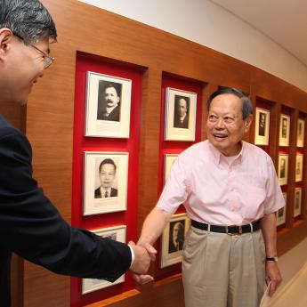 Prof. Dali Yang (left) greets Nobel laureate Chen Ning Yang, PhD'48, during the 2010 opening of the Center in Beijing