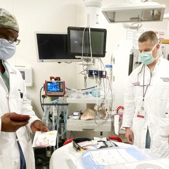 Kenneth Wilson (left) works with Lt. Col. Timothy Plackett at UChicago Medicine