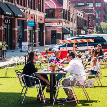 Diners eat outside in Chicago's West Loop neighborhood. A June 2021 survey from AP-NORC shows that 63% of Americans plan to go to at least one bar or restaurant in the next few weeks.