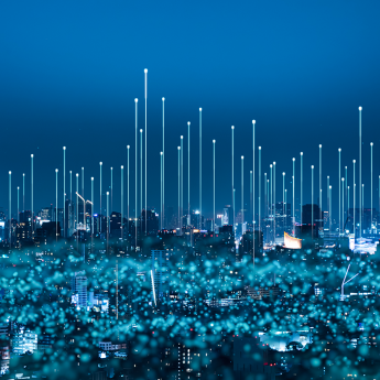 Cityscape with abstract illustration of 5G and WiFi signals.