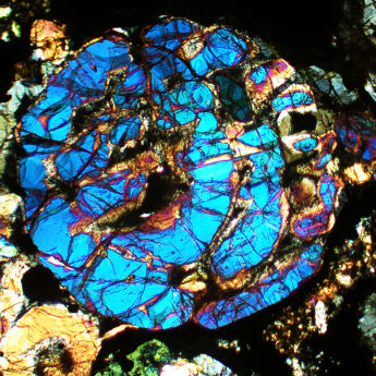 A thin section of a primitive meteorite called an ordinary chondrite