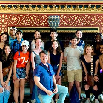 Prof. Larry Norman (center) with students in France for one of the College's Signature Courses.