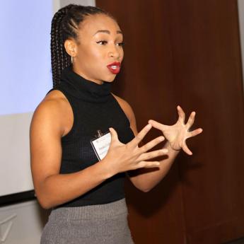 Amaka Uchegbu, left, of BrightUp Financial Wellness and Valerie Mosley, founder and chief visionary officer for BrightUp, speak at the University of Chicago’s annual Professional Services Symposium. 