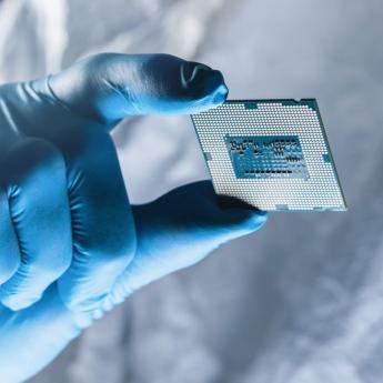 Scientist holding microchip 