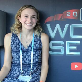 Sara Langs poses for a photo inside the dugout for the 2018 World Series.
