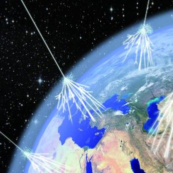 Illustration of cosmic rays making contact with Earth