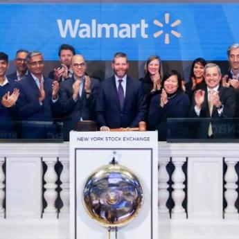 Members of Walmart stand at the NYSE