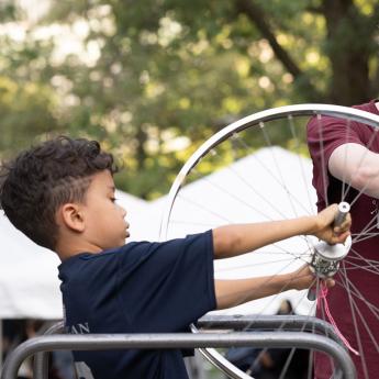 Bicycle wheel demonstration at the South Side Science Festival