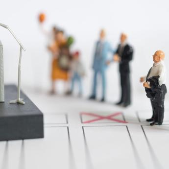 A display of miniature figures depicting a politician speaking to a group of people