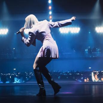 A pop star sings on stage