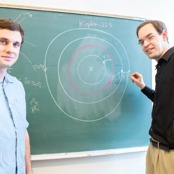 Fabrycky and Mills drawing diagram on chalkboard