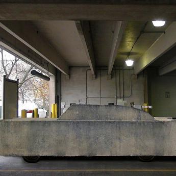 Concrete car in parking garage