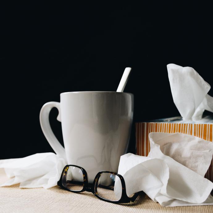 Tissues, tea, and glasses on a table