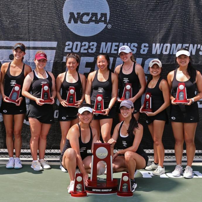 Women's tennis team with second-place trophy
