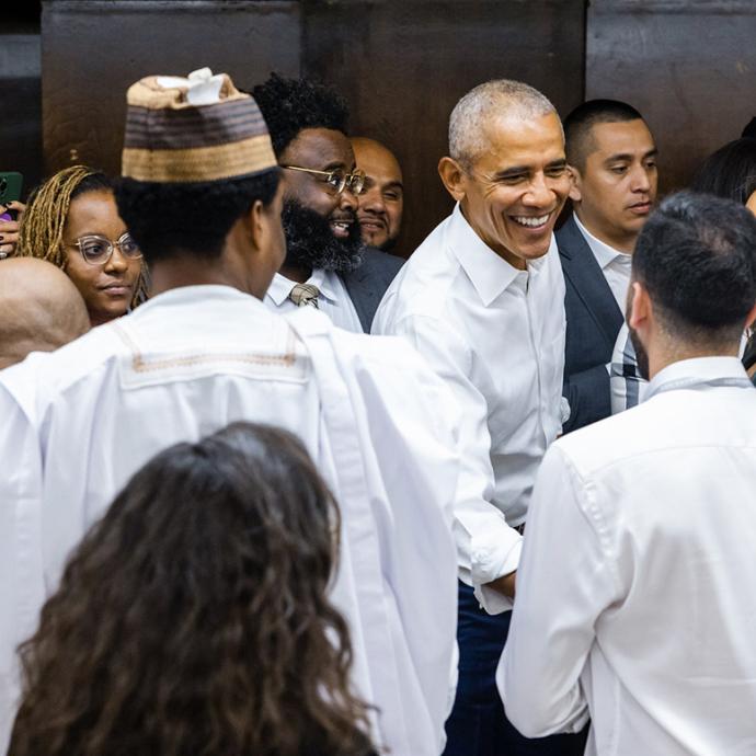 Obama shakes hands with scholars