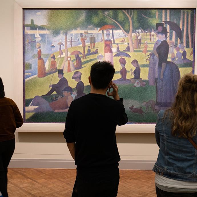 People view a painting at the Art Institute in Chicago 