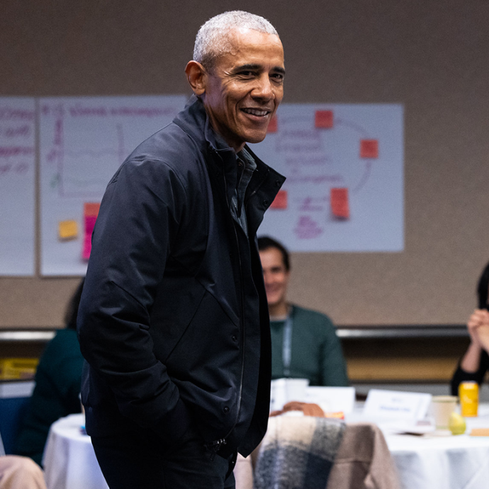 Barack Obama addressing a group of young people sitting at tables