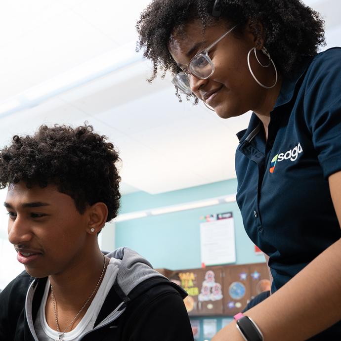 An instructor works with a student at the Education Lab