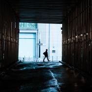 Person walking through alley