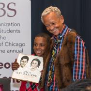 Poet Nikki Giovanni with a child following the 2020 George E. Kent Lecture