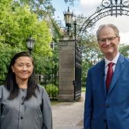 Provost Ka Yee C. Lee and President Paul Alivisatos stand in front of Hull Gate on UChicago's campus