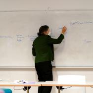 Leila Brammer writes on a whiteboard as part of a course in UChicago's Parrhesia Program