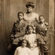 Ida B. Wells-Barnett in a posed portrait with her four children in 1909