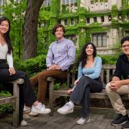 From left to right: Karen Ma, Julian Spencer, Shivanii Batra, and Aryan Kejriwal sitting together on benches on the UChicago campus