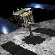 Illustration of spacecraft hovering above a gray rocky surface in space