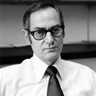 Black and white photograph of Prof Lebovitz looking off-camera wearing a white shirt and tie
