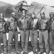 Tuskegee Airmen in front of plane 