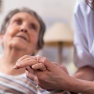 A nurse cares for an elderly patient