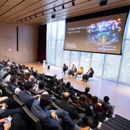 The audience watches a discussion on stage at the Rubenstein Forum during the 2024 Quantum Summit