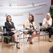 Closeup view of panelists on stage at the Nuclear Assembly