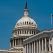 A picture of the U.S. Capitol building against a blue sky.
