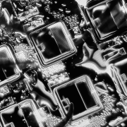 Greyscale scanning electron microscope image of a geometric material.